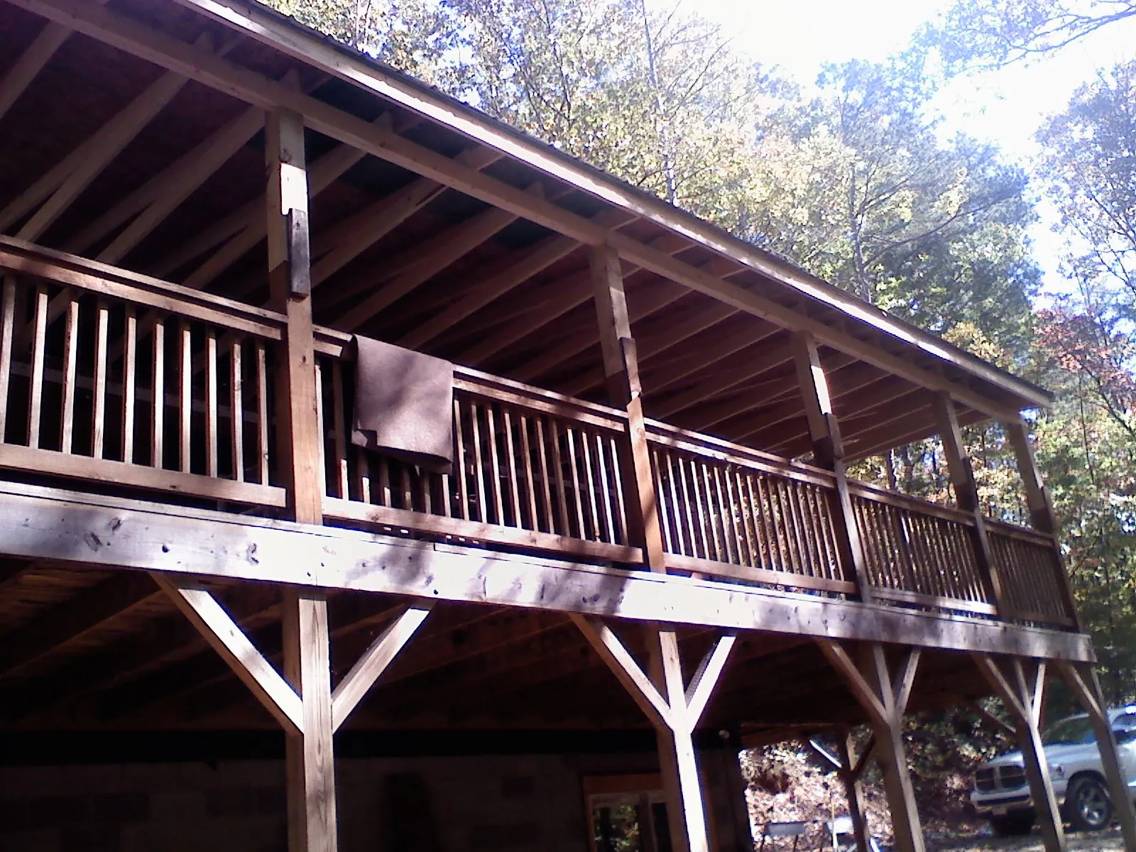 Timber framing under a new elevated porch and deck — Roof Leak Repair in Milton Center by Roofing Brothers